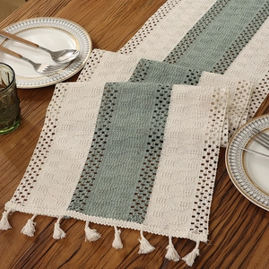 Bohemian striped table runner with sage green color splicing and elegant beige tassels