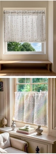 Detailed close-up of a white linen-style cafe curtain with colorful polka dots patterns