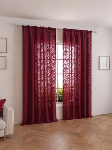 Detailed texture of burgundy lace curtains with elegant floral jacquard pattern