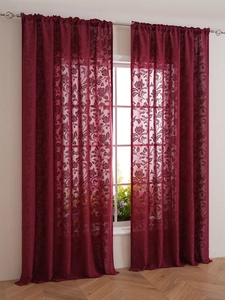 Detailed texture of burgundy lace sheer curtain with elegant floral jacquard pattern
