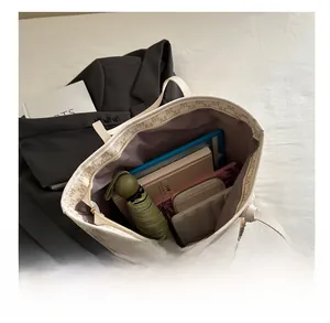 Interior view showing large capacity for tablet, umbrella and wallet in tote bag