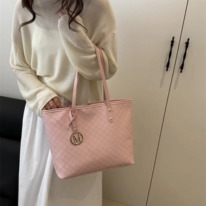 Pink faux leather tote bag with M-letter monogram pattern and gold metal charm