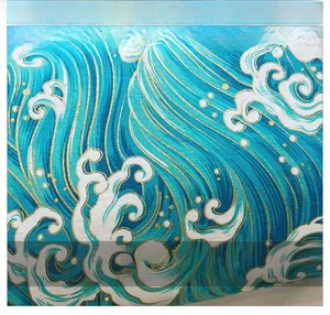 Detailed macro view of ocean wave print fabric with premium gold foil texture