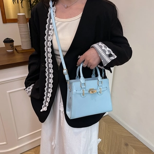 Minimalist sky blue Kelly style handbag with gold lock and detachable shoulder strap