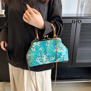 Retro Chinese style water wave pattern handbag with bamboo handle and gold chain strap