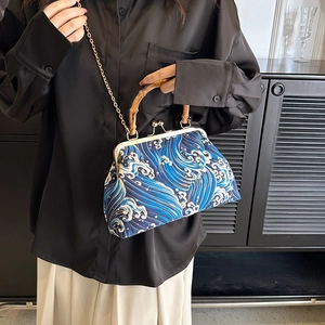 Retro Chinese wave pattern handbag with bamboo handle and gold metal chain strap