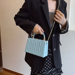 Sky blue quilted chain box bag with wave texture and gold shoulder strap for women