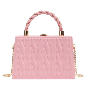 Pink quilted rectangular box bag with gold spiral handle and chain shoulder strap
