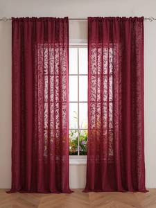 Detailed texture of burgundy lace sheer curtain with elegant floral embroidery and rod pocket