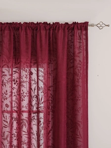 Close-up of burgundy lace curtain with floral leaf patterns and rod pocket design