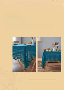 Detail of dark blue lace cutout tablecloth featuring green fringe tassel decorations