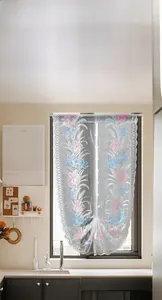 Detailed view of delicate lily floral embroidery and scalloped edges on white lace curtain