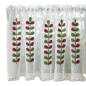 White sheer cafe curtain with green leaf embroidery and white pom-pom fringe trim