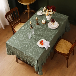 Dark green rectangle lace tablecloth with floral patterns and ruffled edges in a French style
