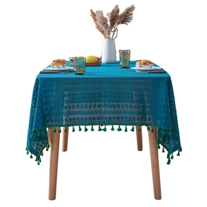 Lace hollow tablecloth in lake blue with geometric patterns and green fringe tassels