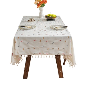 Rectangular cream tablecloth with colorful candy patterns and elegant fringe trim