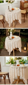 Detail van vintage off-white kant tafelkleed met bloemmotief en hol borduursel