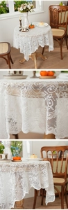 Macro detail van wit vintage kanten tafelkleed met elegante geschulpte golvende randen