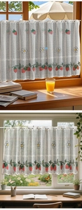 Detail of embroidered strawberry and daisy lace cafe curtain on rustic wooden window