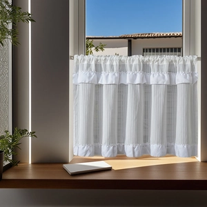 White minimalist ruffled cafe curtain with textured fabric shown on a wooden windowsill