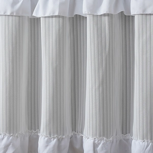 Vertical pleated white cafe curtain with elegant ruffled edges for kitchen windows