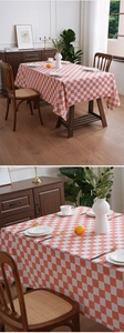 Detailed macro view of red and white checkerboard tablecloth with linen texture fabric