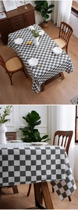 Detail of checkered tablecloth showing woven fabric texture and elegant edge drape
