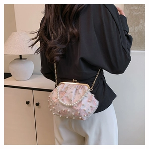 Floral crossbody shell bag with white pearl embellishments and gold chain strap detail