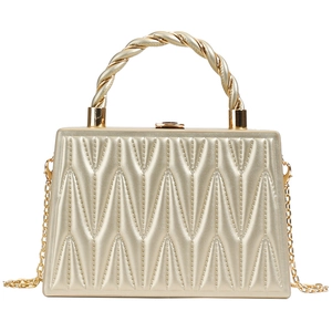 Champagne gold quilted crossbody bag with metal spiral handle and chain strap