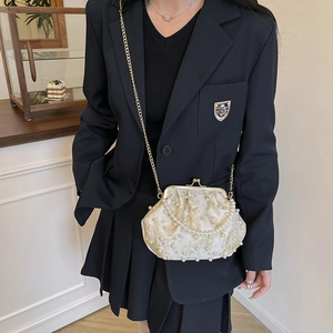 Elegant vintage cream pearl shell bag with gold embroidery and a delicate metal chain