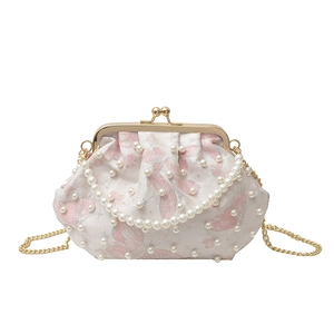 Elegant white pearl-embellished shell bag with pink floral patterns and gold chain strap