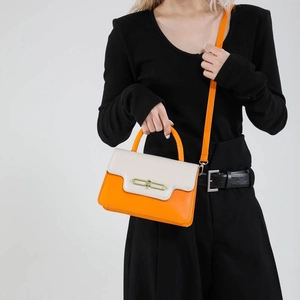 Fashionable color-block small square handbag with orange handles and gold hardware