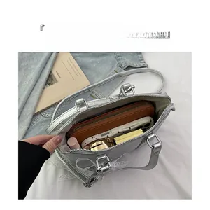 Top view of silver bow-knot bag showing large capacity for wallet and cosmetics