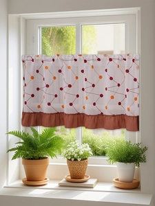 Detail of semi-sheer cafe curtain with tulip embroidery and terracotta pleated trim