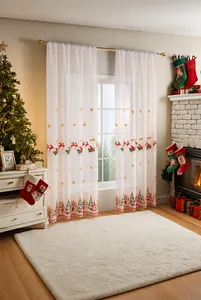 Detail of Christmas sheer curtain with red sleigh and green tree embroidery motifs