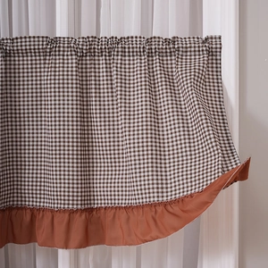 Country style brown plaid cafe curtain with ruffled hem displayed on a white window