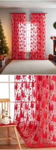 Detail of red Christmas sheer curtain featuring alpaca and holiday tree embroidery