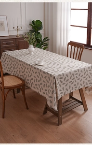 Detailed view of leaf pattern polyester tablecloth with elegant fringe edge finish