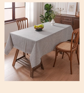 Close-up of a classic navy checkered tablecloth featuring a natural linen-like cotton texture