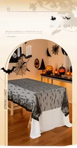 Halloween lace tablecloth featuring bats and haunted house patterns on a wooden table