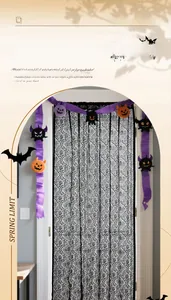 Macro detail of black lace Halloween door curtain with spider web patterns and plush charms