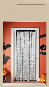 Detail of black mesh curtain with skull patterns for Halloween doorway decoration