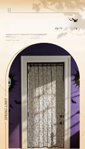 Detail of black lace Halloween door curtain featuring a classic spider web mesh pattern