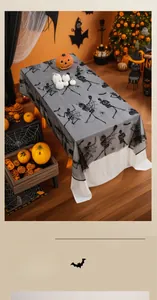 Detail of Halloween black lace gauze tablecloth with skull and spider web patterns