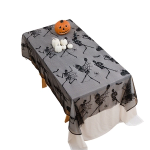 Halloween black lace tablecloth featuring skeletons and spiderwebs for party decor