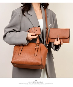 Detailed view of the 3-piece brown crocodile texture handbag set with metallic buckles