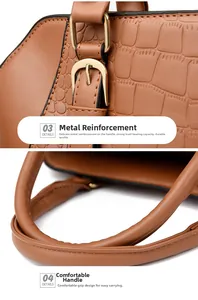 Detail of brown crocodile pattern handbag with sturdy gold metal hardware and rounded handle