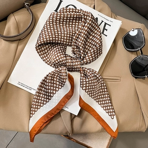 Elegant faux silk square scarf with geometric chain print on khaki blazer and magazine