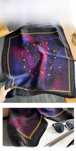Detail of luxury silk square scarf with vintage gold chain and leopard floral patterns