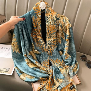 Silky fashion scarf with blue and orange botanical prints and butterfly motifs